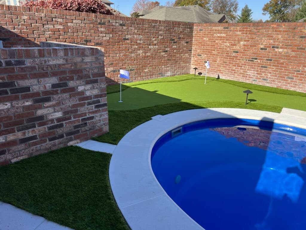 Image of fiberglass pool construction with retaining walls and decorative concrete in Borden, Indiana