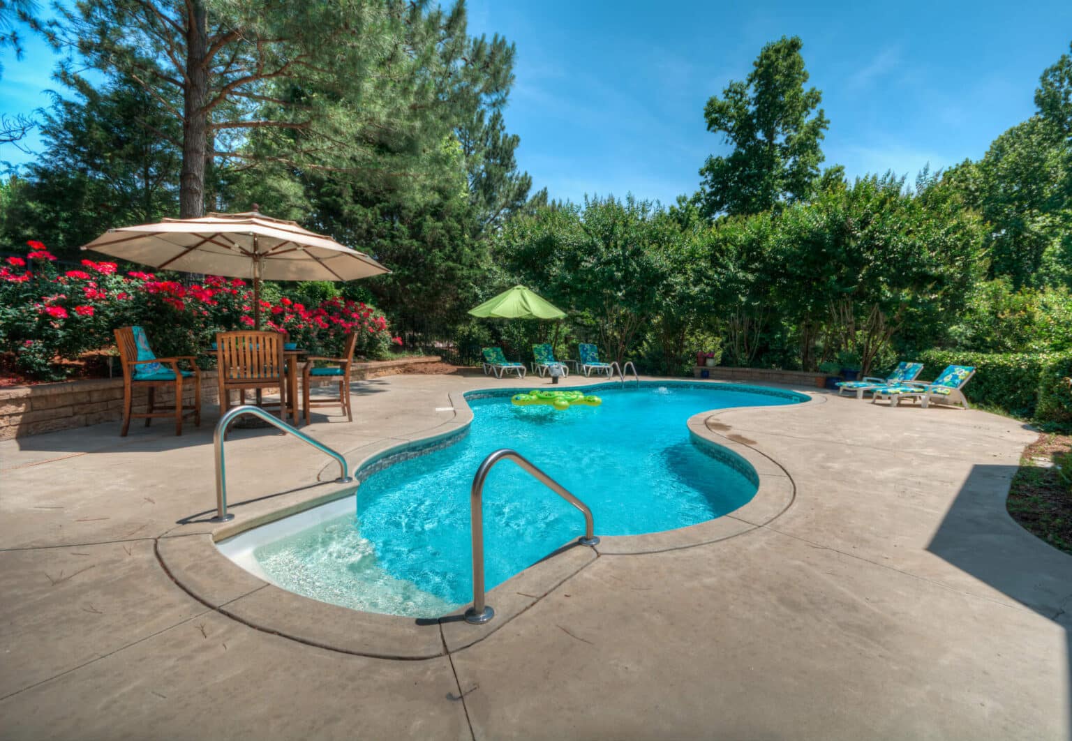 Image of pool installation Borden IN featuring a custom fiberglass swimming pool